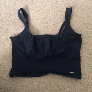 A black stretchy crop top from Hollister with adjustable straps. Size: small
